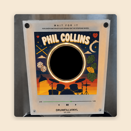 The face of the Phil Collins vinyl frame on a cream background